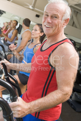 Man Running On Treadmill At Gym