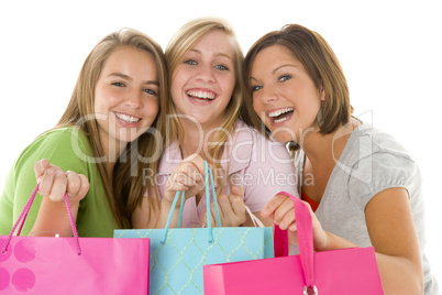 Portrait Of Teenage Girls Holding Shopping Bags