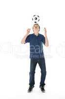 Portrait Of Teenage Boy With A Soccer Ball