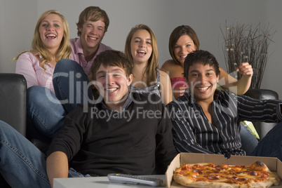 Teenagers Having Fun And Eating Pizza