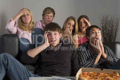 Teenagers Having Fun And Eating Pizza