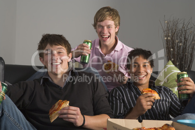 Teenage Boys Eating Pizza