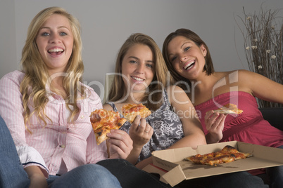 Teenage Girls Eating Pizza