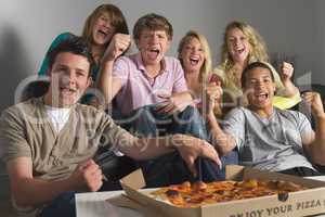 Teenagers Having Fun And Eating Pizza