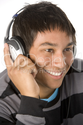 Teenage Boy Listening To Music On Headphones