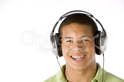 Teenage Boy Listening To Music On Headphones