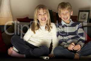 Brother And Sister Watching Television