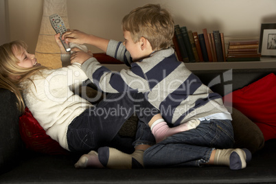 Brother And Sister Fighting Over Remote Control