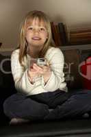 Young Girl Using Remote Control