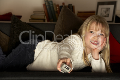 Young Girl Using Television Remote Control