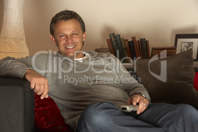 Man Relaxing With Remote Control