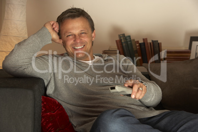 Man Relaxing With Remote Control
