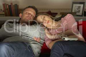 Couple Asleep In Front Of Television