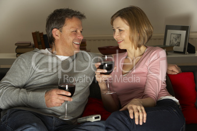 Couple Drinking Wine And Not Watching Television