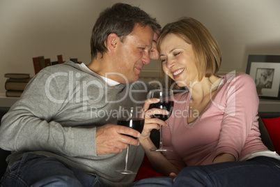 Couple Drinking Wine And Not Watching Television