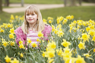 Young Girl Surrounded By Daffodils