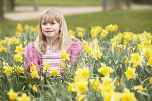 Young Girl Surrounded By Daffodils