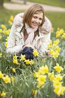 Woman Kneeling In Daffodils
