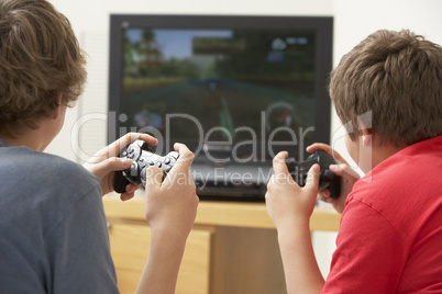 Two Boys Playing With Game Console