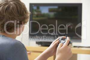 Teenage Boy Playing With Game Console