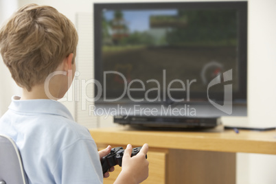 Young Boy Playing With Game Console