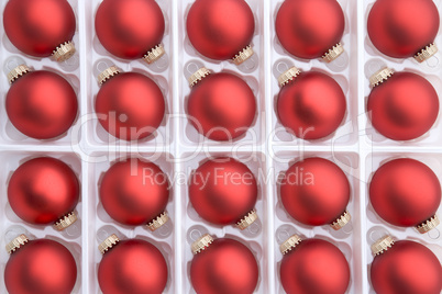 Red christmas baubles in box