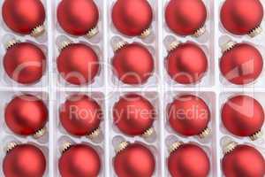 Red christmas baubles in box