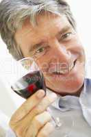 Man Drinking A Glass Of Red Wine