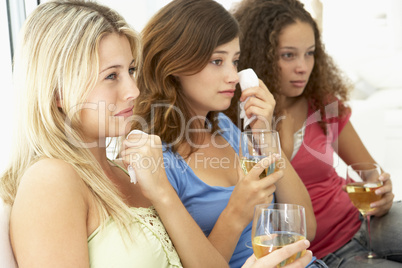 Female Friends Watching A Sad Movie Together