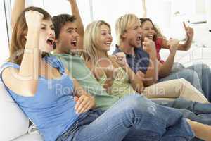 Friends Watching A Game On Television