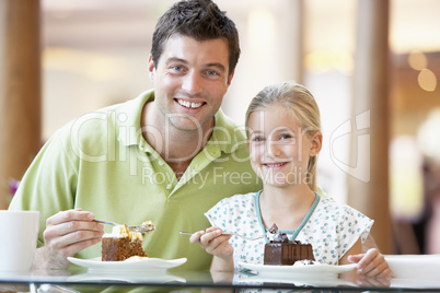 Father And Daughter Having Lunch Together At The Mall