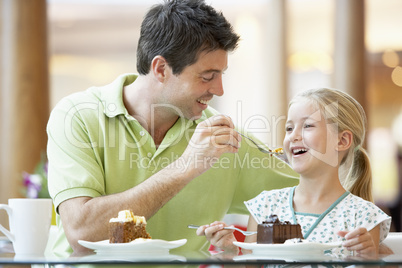 Father And Daughter Having Lunch Together At The Mall