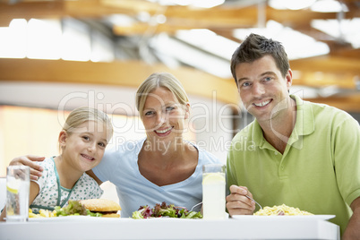 Family Having Lunch Together At The Mall