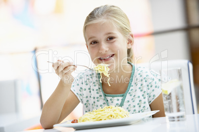 Girl Eating Lunch At A Cafe