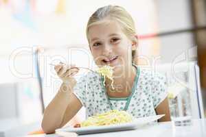 Girl Eating Lunch At A Cafe
