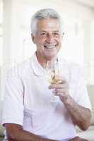 Man Enjoying A Glass Of White Wine