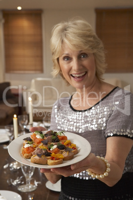 Woman With Hors D'oeuvres For A Dinner Party