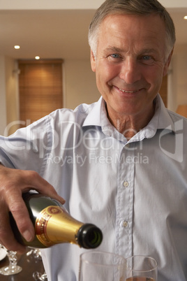 Man Pouring A Glass Of Champagne
