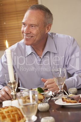 Man Eating Dinner At Home