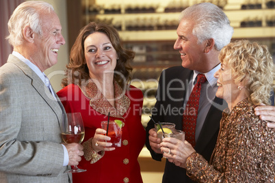 Friends Socializing At A Bar