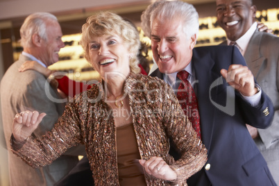 Couples Dancing Together At A Nightclub