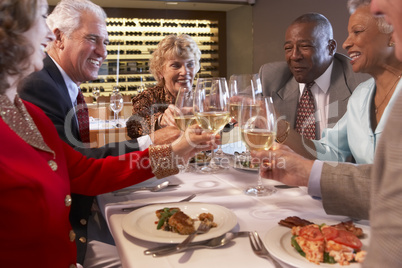 Friends Having Dinner Together At A Restaurant