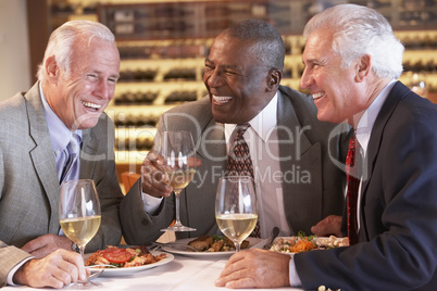 Friends Having Dinner Together At A Restaurant