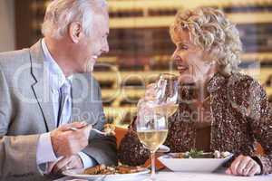 Senior Couple Having Dinner Together At A Restaurant