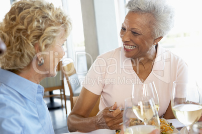 Friends Having Lunch Together At A Restaurant