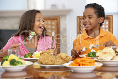 Brother And Sister Having Lunch Together At Home