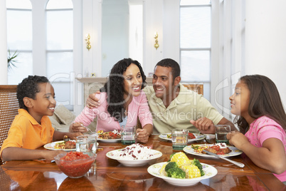 Family Having A Meal Together At Home