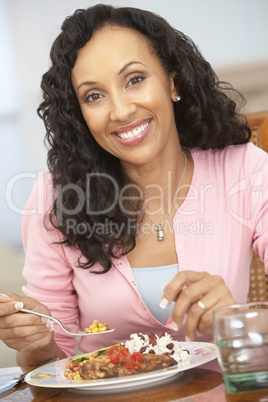 Woman Enjoying A Meal At Home