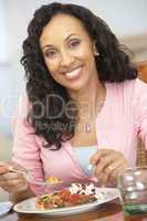 Woman Enjoying A Meal At Home