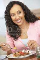 Woman Enjoying A Meal At Home